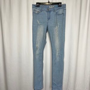 Distressed skinny blue jeans